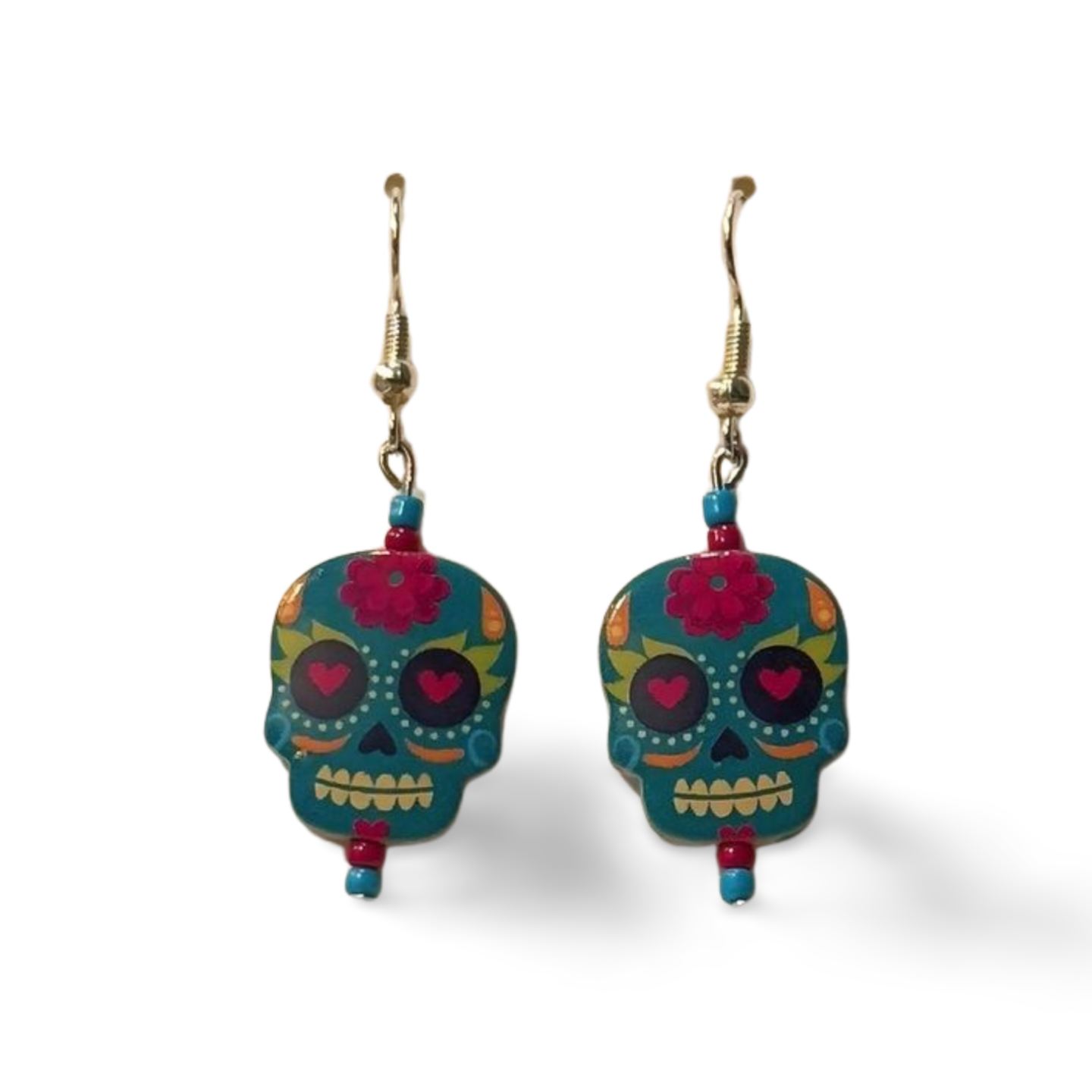 Colorful teal Sugar Skull metal beads featured on gold-colored fish hook earring wires